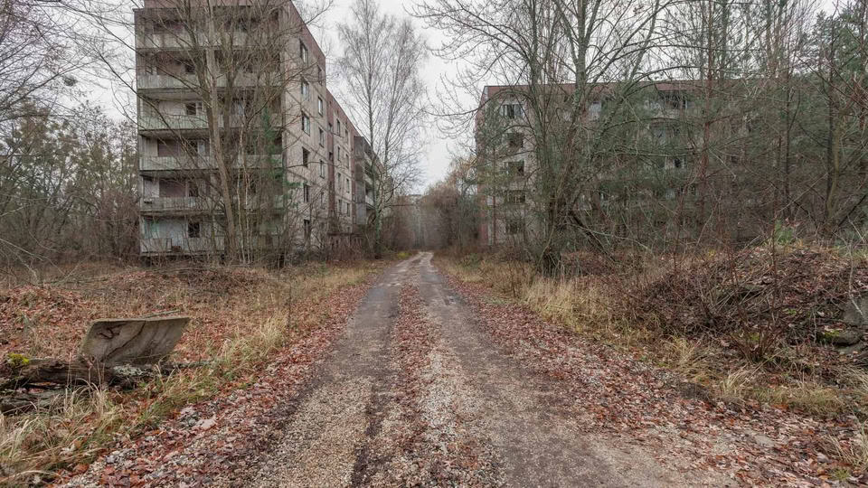 Abandoned buildings in overgrown ghost city pripyat